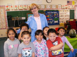 Sister Peggy smiles with children at Our Lady of the Rosary School.