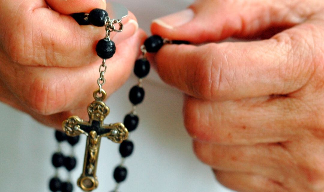 Sister rosary in hand_misc